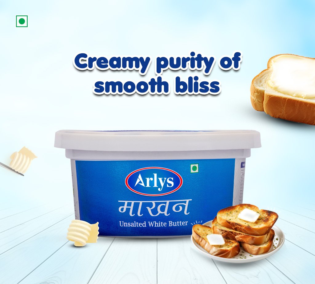 Tub of Arlys unsalted white butter on a light blue background, with buttered bread nearby.