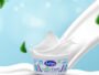 Container of Arlys Active Curd with a white milk splash against a blue background, conveying freshness and energy.