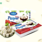 Arlys Malai Paneer packaging with a bowl of cubed paneer beside it.
