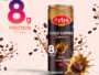 Arlys Cold Coffee cappuccino can with 8 g protein per pack, surrounded by coffee splashes and beans on a pale pink background.