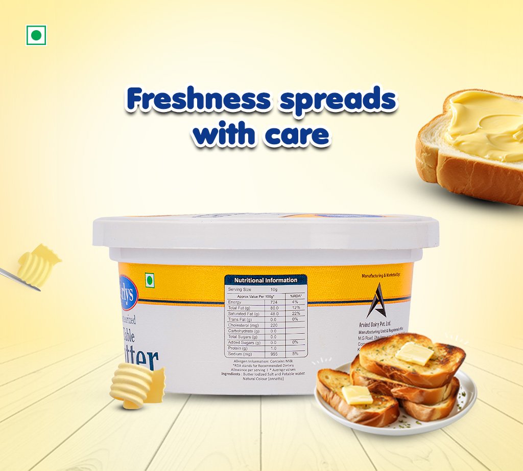 Bright ad showing a tub of butter with toasted bread and a plate of buttered crostini; caption reads 'Freshness spreads with care' conveying a dairy product's quality.