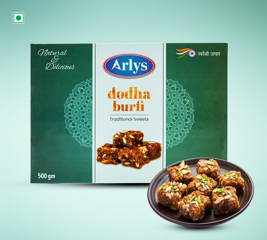 Box of Arlys dodha burfi traditional sweets, 500 g, with a plate of square burfi pieces topped with nuts.