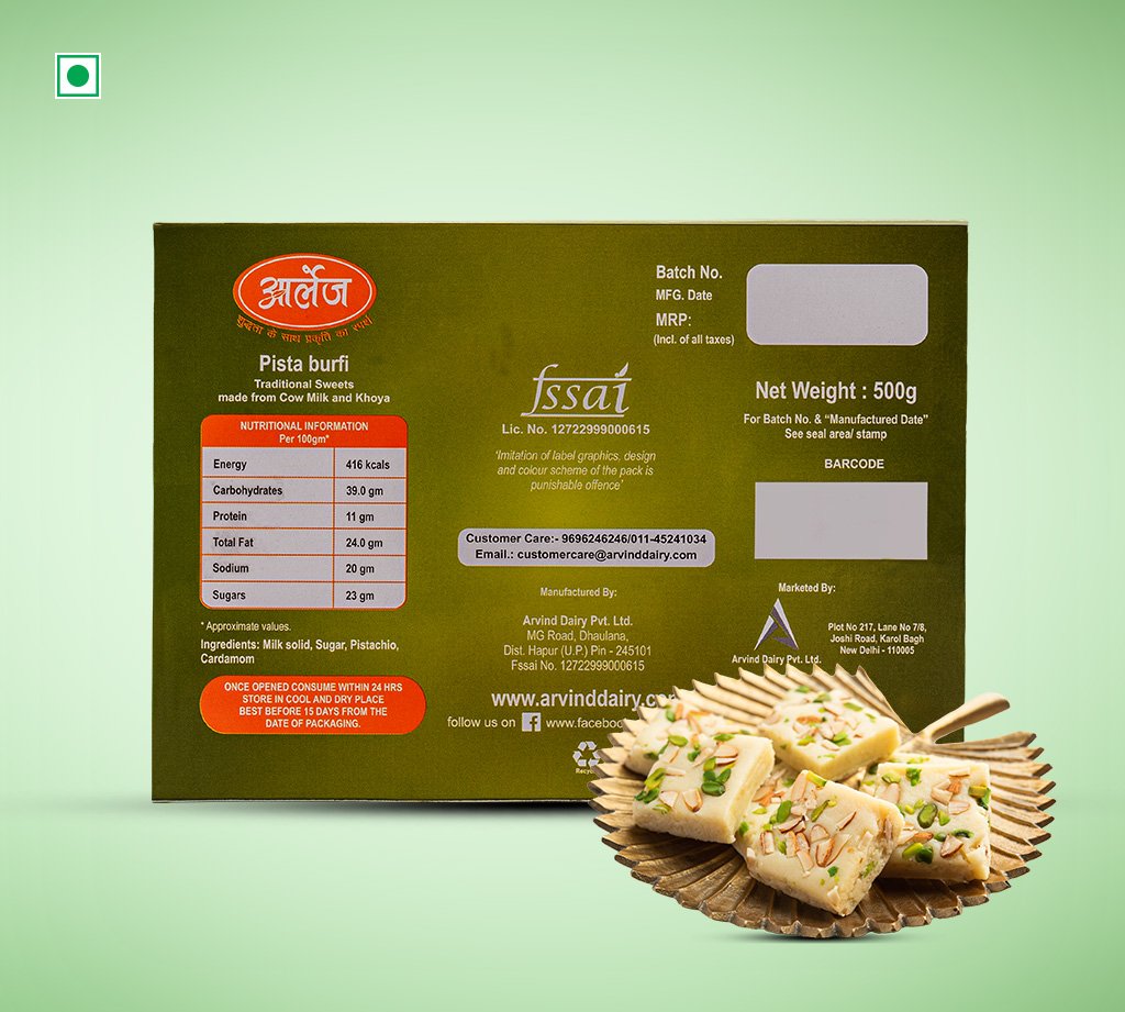 Brown packaging box labeled Pista burfi (traditional sweets) with a plate of pistachio-topped burfi in front against a green background