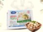Front of Arlys Masala Tofu package with a bowl of cubed tofu beside it; faint muscular figure in background.