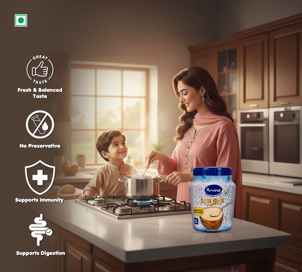 Mother and child cook at a kitchen island with a jar of Arvind Desi Ghee on the counter; left-side icons list benefits: Great Taste, No Preservatives, Supports Immunity, Supports Digestion.