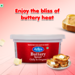Container of Arlys Butter Spread on a pink gradient background with toast and pats of butter, and the slogan 'Enjoy the bliss of buttery heat'.